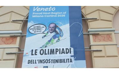 venezia blitz degli ambientalisti contro le olimpiadi dell instostenibilit la faccia di zaia incollata sul manifesto