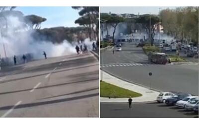 roma lazio il video degli scontri tra ultr all olimpico la polizia lancia lacrimogeni