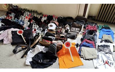 scarpe e t shirt nike e armani false sequestrati 200 articoli al mercato di porta portese